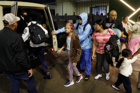 Residents evacuate a building near the Miraflores presidential palace.