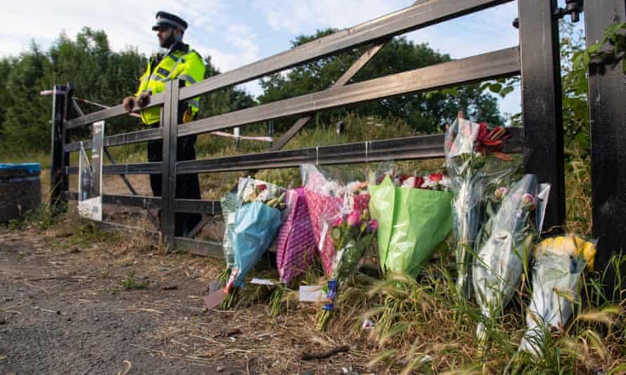 Flowers at an entrance to Fryent Country
                        Park, in Wembley, north London, where Nicole
                        Smallman and Bibaa Henry were killed.