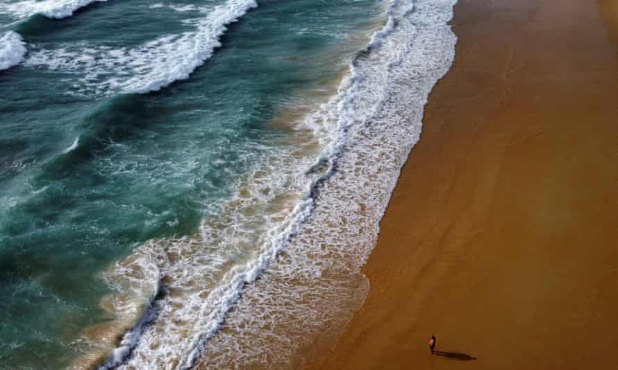 ‘Devastated’ Phuket in race to vaccinate 70% of islanders in time for holiday season | Thailand 1 An empty beach on Phuket in April.