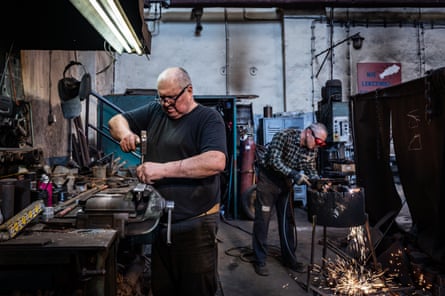 two workers at the foundry of the Wujek coalmine, which is still in operation and managed by PGG