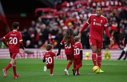 Liverpool’s Virgil van Dijk with Diogo Jota’s sons and other relatives before kick-off at Anfield