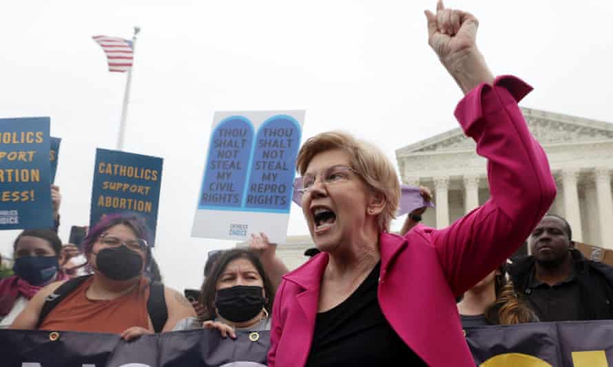 Democratic Senator Elizabeth Warren joins protesters demanding the retention of abortion rights afforded under the supreme court decision Roe vs Wade, outside the court building in Washington a little earlier today.