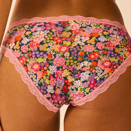 Close up of a model wearing Stripe & Stare floral knickers with pink lace trim