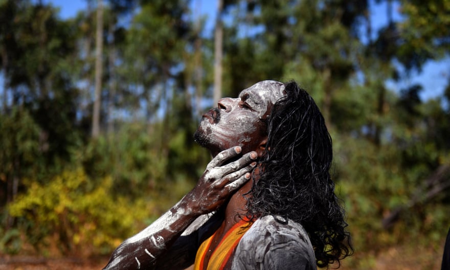 A member of the Gumatj clan of the Yolngu people from north-eastern Arnhem Land prepares for the Bunggul traditional dance at the Garma festival on Friday