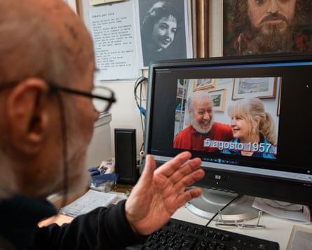 Playing a video featuring his wife Lina who lives in the same facility.