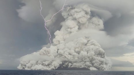 Tonga volcano: smoke and lightning seen before eruption that caused tsunami – video