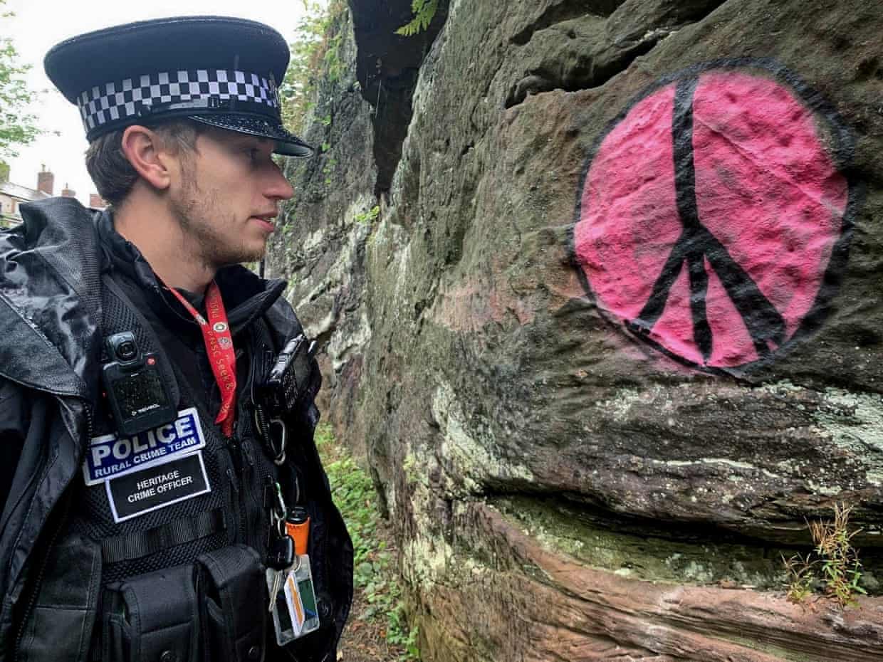 Heritage crime officer, PC Ashley Tether, looks at the graffiti on the city walls of Chester. Photograph: Cheshire Constabulary