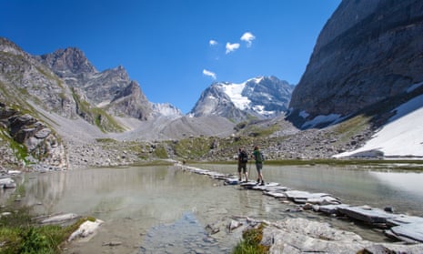 Walkers explore Vanoise national park near the resorts of Courchevel and Val-d’Isère, France.