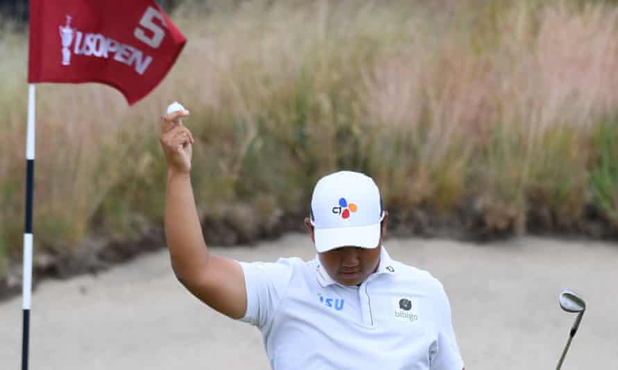 Joohyung Kim of South Korea reacts to an eagle on the fifth green