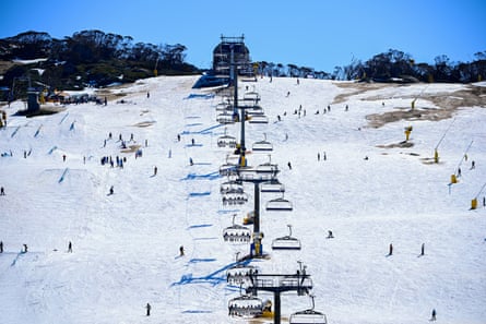 People ski on human-made snow at Perisher