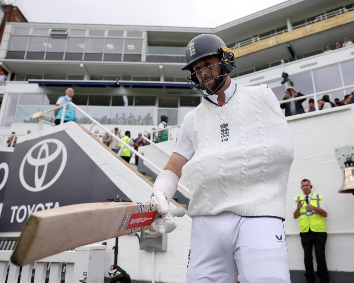 Chris Woakes walks out to bat against India at the Oval, his left arm in a sling for his England swansong