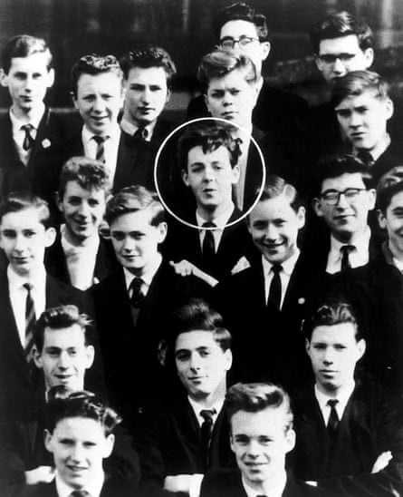 A black and white photograph of schoolboys all wearing blazers and ties