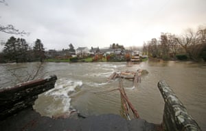 'It was like a disaster movie unfolding in front of us' ... the bridge being swept away by floods in December 2015.