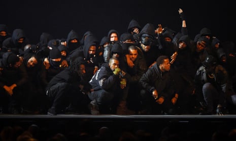 In a sombre mood … Kanye West was joined by a posse which included UK grime artists at the 2015 Brit awards.