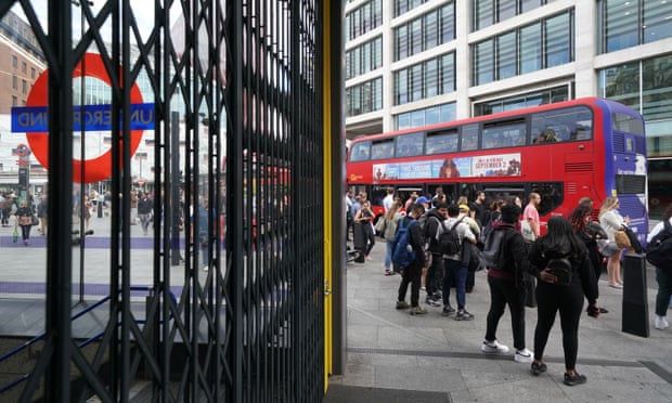 People waiting for buses outside Victoria tube station on Friday