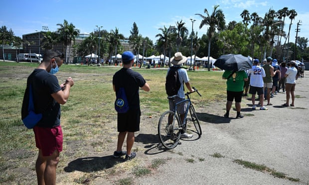 People wait in line for the monkeypox vaccine at the Balboa Sports Center in the Encino neighborhood of Los Angeles.