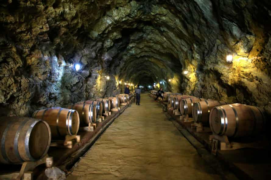 Barrels of red wine in a cave cellar in Danba county, Ganzi Tibetan Autonomous Prefecture.