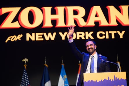 Zorhan Mandami waves to supporters at an election night rally.