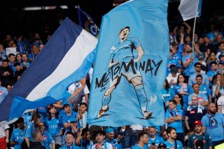 Fans hold a flag with the image Napoli’s Scott McTominay