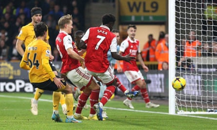 Arsenal go five points clear at top after Martin Ødegaard double sinks Wolves | Premier League 1 Martin Ødegaard bundles home Arsenal’s first goal against Wolves