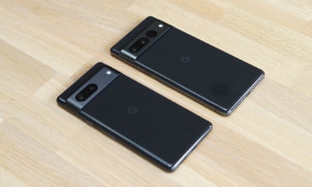 The Pixel 7 next to the Pixel 7 Pro lying flat on a table.