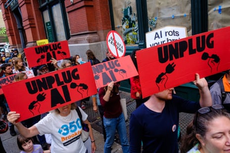 people hold signs that say 'unplug AI'