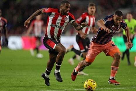 Toney vies with Murillo for the ball.
