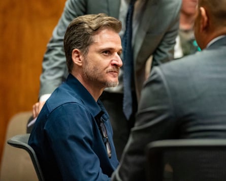 Gerhardt Konig talks to his defense lawyer successful court