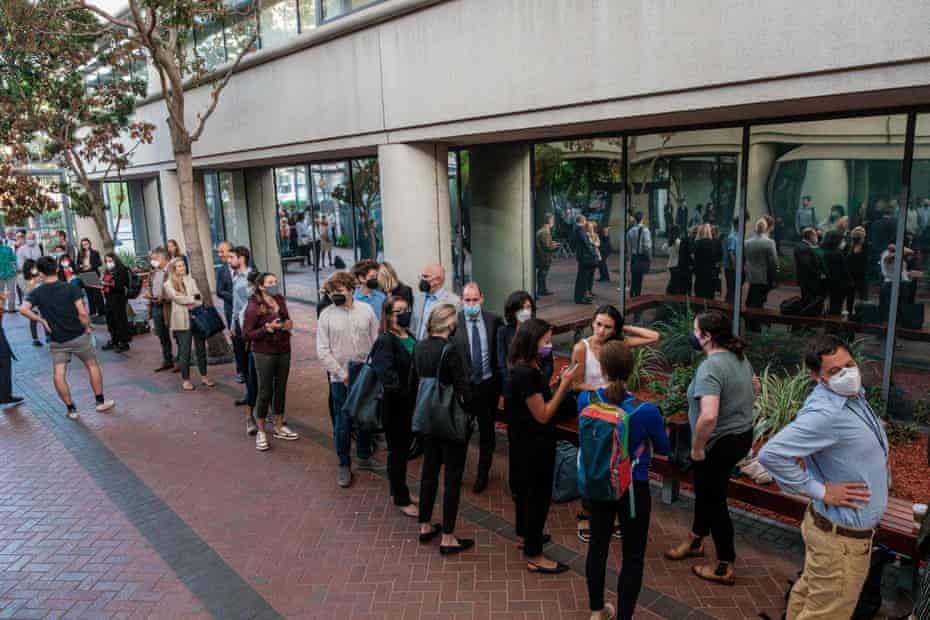 People line up for the fraud trial of Elizabeth Holmes outside the courthouse in San Jose on 8 September.