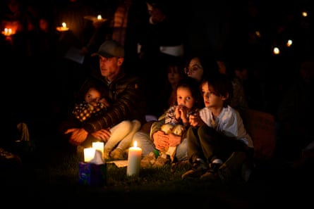 people surrounded by candles