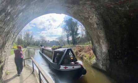 A walker and a boat entering the Chirk tunnel.
