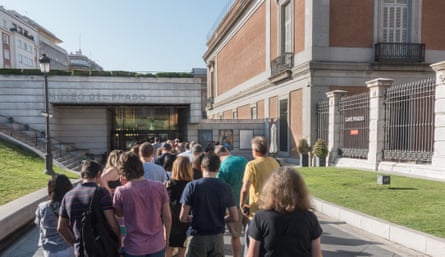 Backs of people queuing