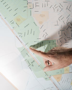 Roy Heald, general manager of Security’s water district, points to contaminated well sites on a map in the water district meeting room in Colorado Springs, CO.