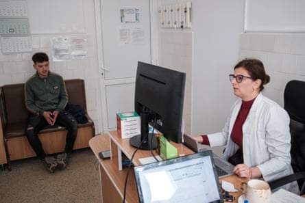 Dr Mirela Csabai sees a patient in her office at the Săcele municipal clinic.