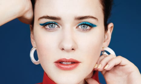 Close-up of Rachel Brosnanhan's face, a streak of bright blue eyeshadow and thick hoop earrings