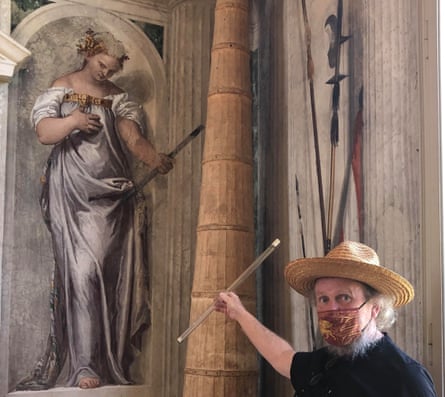 Anthony Arnold comparing his glass flute to a fresco in Villa di Maser, Italy