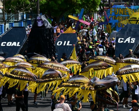Protesters transportation oversize coffins marked coal, lipid and gas