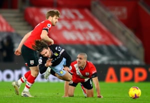 Aston Villa’s Jack Grealish (centre) is fouled by Southampton’s Stuart Armstrong (left) as Oriol Romeu looks on.