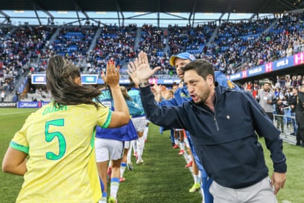 Brazil head coach Arthur Elias high fives Duda Sampaio ahead of their 2-1 friendly victory over the United States in April