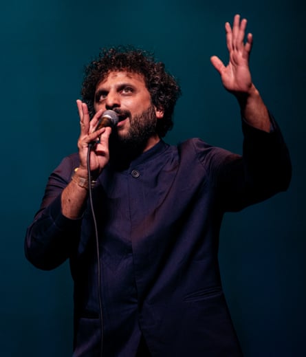 Nish Kumar live on stage.