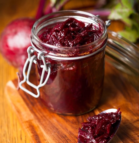Red beetroot chutney in a jar with a spoonBeetroot and balsamic chuthey