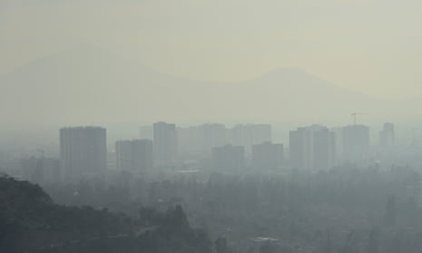 A layer of smog over Santiago caused by industry emissions and a growing number of cars.