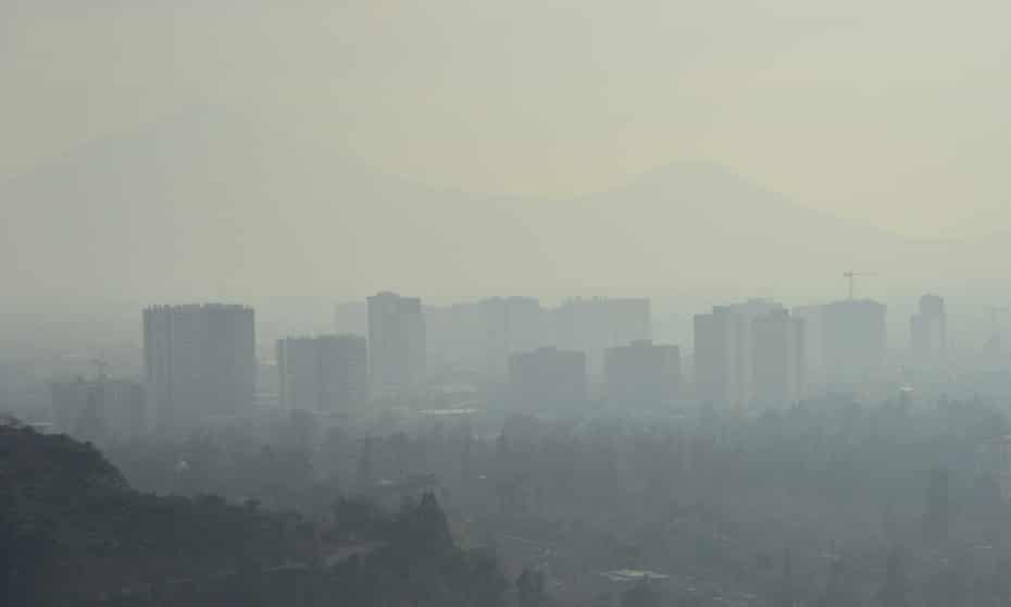 A layer of smog over Santiago caused by industry emissions and a growing number of cars.