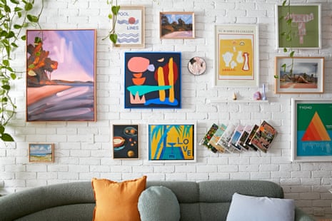 A detail of the wall in Jono Fleming’s living room shows artworks, magazines and trailing ivy