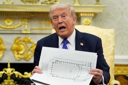 a man holds a seating chart