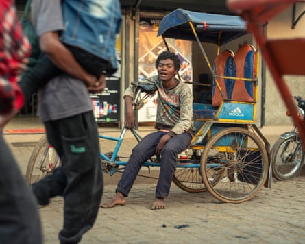 A barefoot rickshaw driver in Antsirabe, Madagascar.