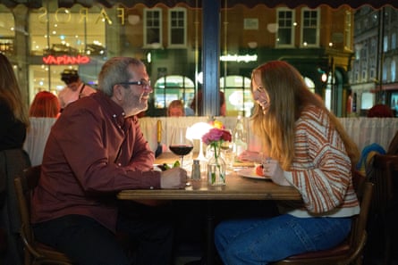 Steve and Eva chatting across a restaurant table