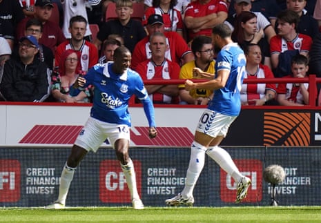 Abdoulaye Doucoure (left) celebrates with Arnaut Danjuma after scoring Everton’s first goal of the Premier League season at Bramall Lane.