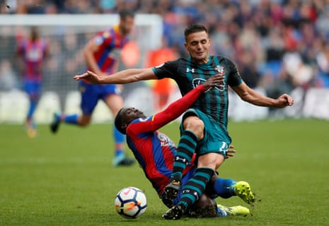 Southampton’s Dusan Tadic is tackled by Crystal Palace’s Jeffrey Schlupp.