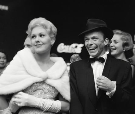 A black and white photo of an elegantly dressed man and woman.